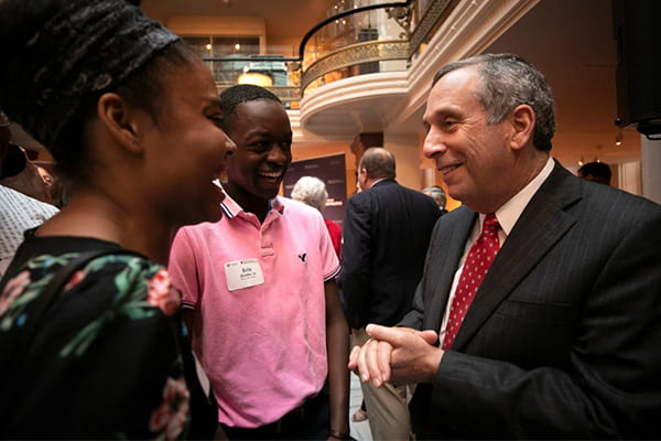 president bacow with students